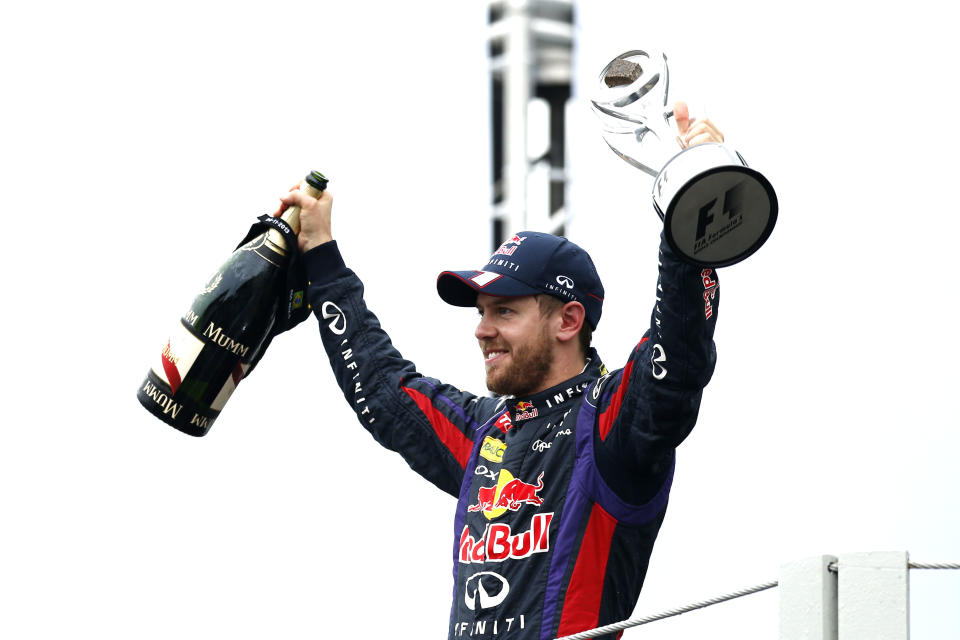 Seen here, Sebastian Vettel celebrating his fourth consecutive Formula One world title in 2013.