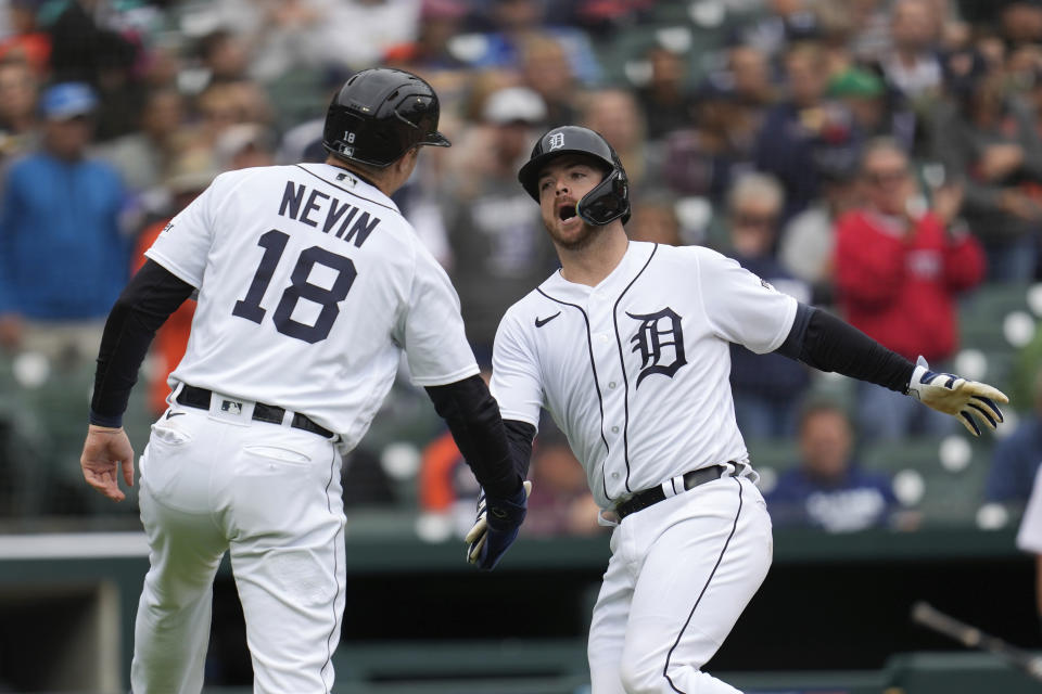 Detroit Tigers' Jake Rogers, right, celebrates his two-run home run with Tyler Nevin (18) against the Kansas City Royals in the eighth inning of a baseball game that was suspended Wednesday night because of rain, Thursday, Sept. 28, 2023, in Detroit. (AP Photo/Paul Sancya)