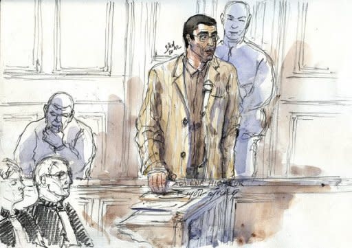 A court sketch created March 29, shows Franco-Algerian physicist Adlene Hicheur (C), a former researcher at the European Organisation for Nuclear Research (CERN), speaking during his trial in Paris. The court sentenced Hicheur Friday to four years in jail after he was convicted of plotting with Al-Qaeda's north African branch to carry out terror attacks