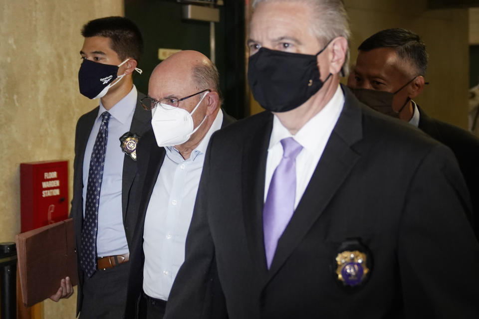 The Trump Organization's Chief Financial Officer Allen Weisselberg, second from left, arrives to a courtroom in New York, Thursday, July 1, 2021. Donald Trump’s company and its longtime finance chief were charged Thursday in what a prosecutor called a “sweeping and audacious” tax fraud scheme that saw the Trump executive allegedly receive more than $1.7 million in off-the-books compensation, including apartment rent, car payments and school tuition.(AP Photo/Seth Wenig)