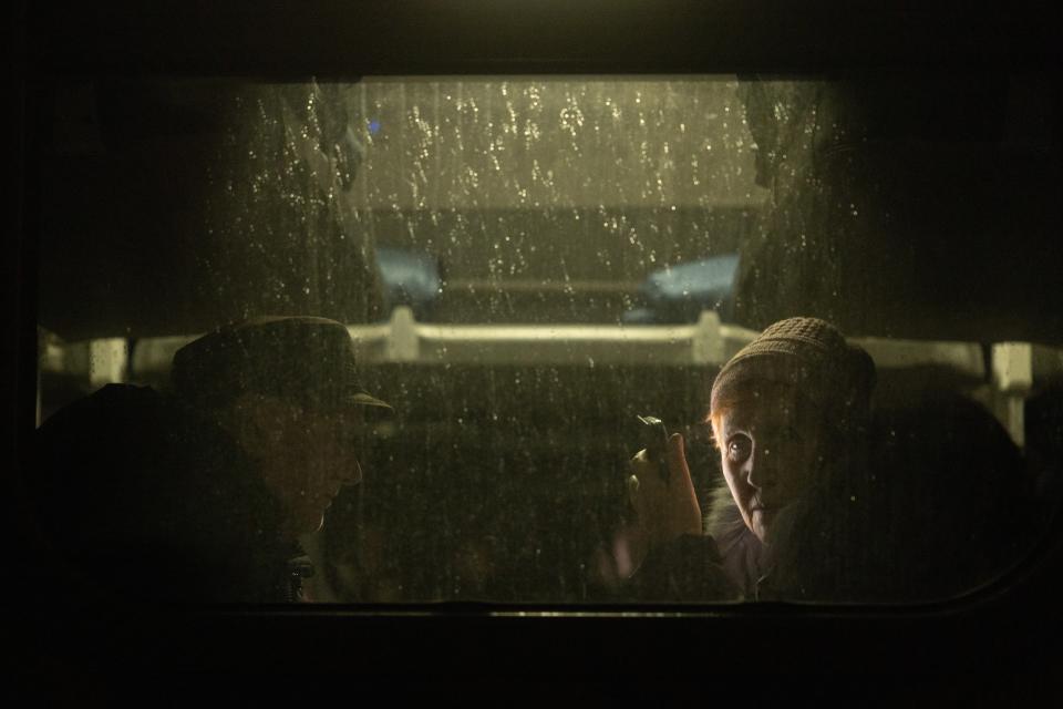 A woman looks out the train window while waiting for an evacuation train to leave from Kherson, Ukraine (Getty Images)