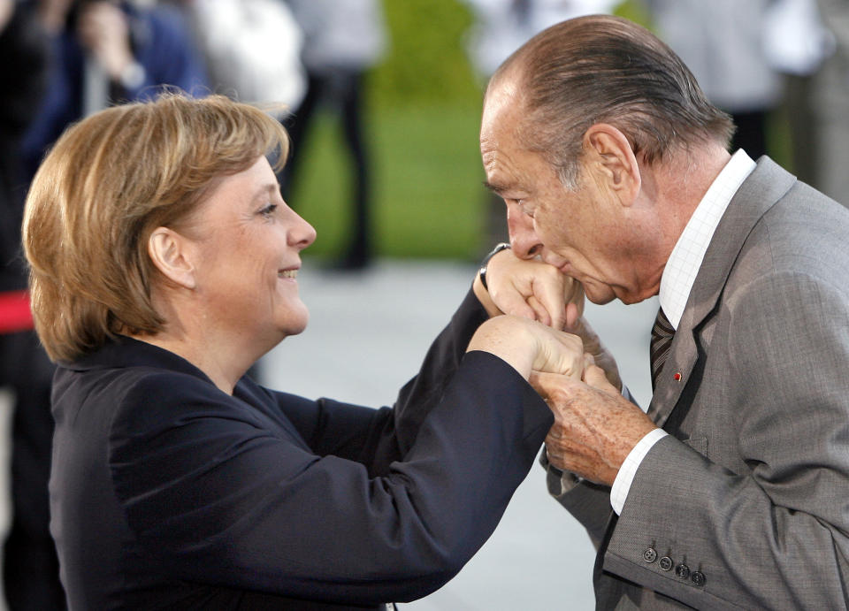 FILE - German Chancellor Angela Merkel, left, welcomes President Jacques Chirac of France, right, at the chancellery in Berlin, May 3, 2007. Merkel has been credited with raising Germany’s profile and influence, helping hold a fractious European Union together, managing a string of crises and being a role model for women in a near-record tenure. Her designated successor, Olaf Scholz, is expected to take office Wednesday, Dec. 8, 2021. (AP Photo/Michael Sohn File)