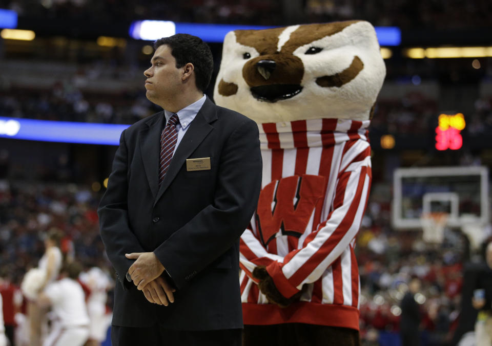 The Wisconsin mascot mimics a security guard during a time out during the second half in a regional semifinal NCAA college basketball tournament game against Baylor, Thursday, March 27, 2014, in Anaheim, Calif. Wisconsin won 69-52. (AP Photo/Jae C. Hong)