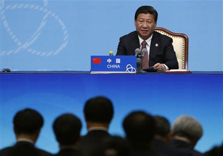 China's President Xi Jinping delivers a speech to the media during the fourth Conference on Interaction and Confidence Building Measures in Asia (CICA) summit, in Shanghai May 21, 2014. REUTERS/Aly Song