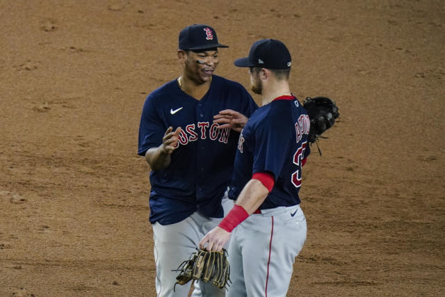 Boston Red Sox players, from left, Christian Vazquez, Xander Bogaerts, Matt  Barnes, Marwin Gonzalez and Rafael Devers celebrate after defeating the New  York Yankees during a baseball game, Friday, June 25, 2021