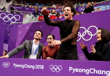 Tessa Virtue and Scott Moir of Canada react after their performance. REUTERS/John Sibley