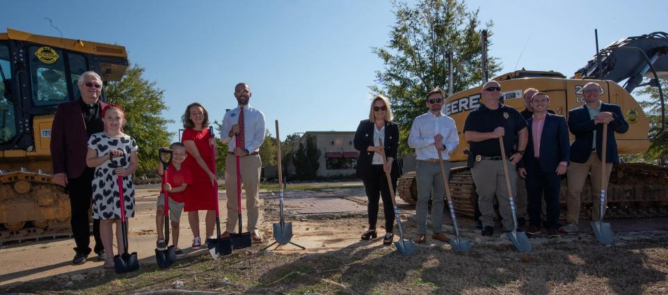 Ian Hodges, center left, franchise owner of a Chick-fil-A to be built in Flowood, and his family join representatives of the city of Flowood, right, to break ground for the new business Wednesday, Oct. 9, 2024.