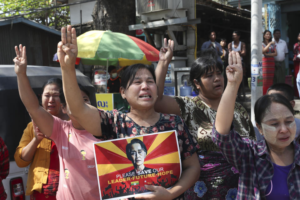 Women hold a portrait of deposed Myanmar leader Aung San Suu Kyi, during an anti-coup demonstration in Mandalay, Myanmar, Friday, March 5, 2021. Protests continue in Myanmar against the Feb 1 military coup that ousted the civilian government of Aung San Suu Kyi. Despite daily operations by police to disperse the crowds, defiant protesters continue to return to the streets in parts of the country.(AP Photo)