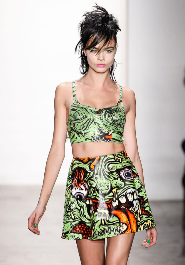 <b>New York Fashion AW13: Weird and wonderful runway looks<br><br></b>Cara Delevingne dons a brunette spiky mullet and very bizarre crop top and matching skirt - covering in drooling monster cartoons.<b><br></b>