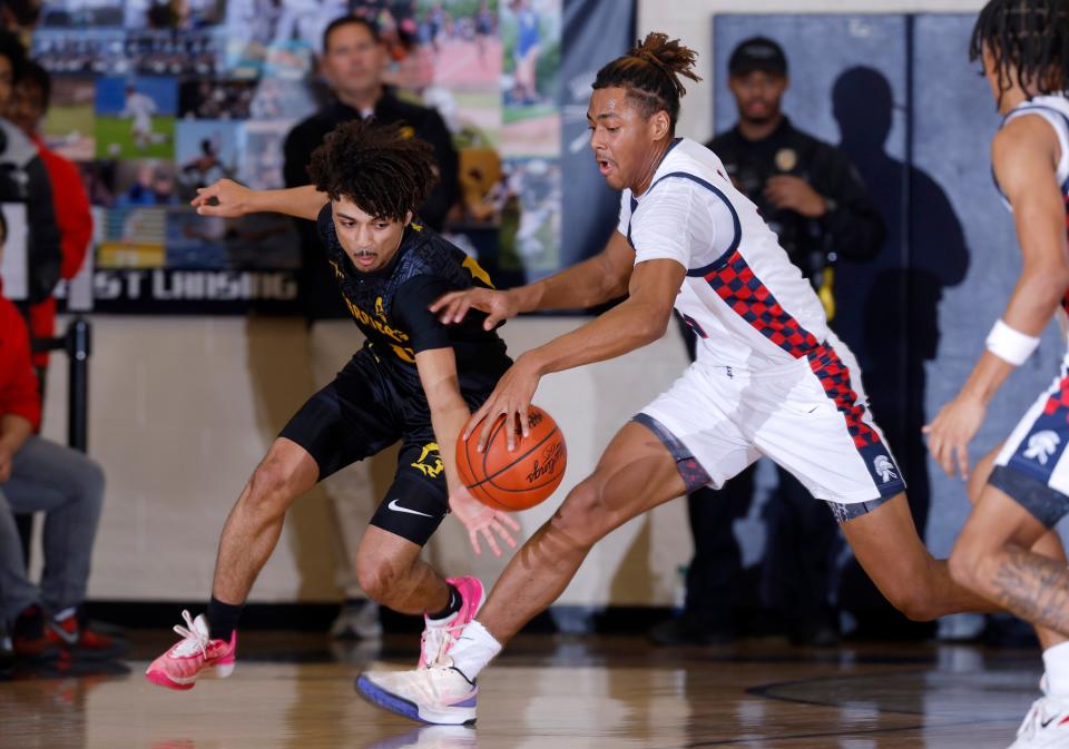 Waverly's Kavandre Pena, left, and East Lansing's JL Branson chase the ball, Thursday, Jan. 11, 2024, in East Lansing.