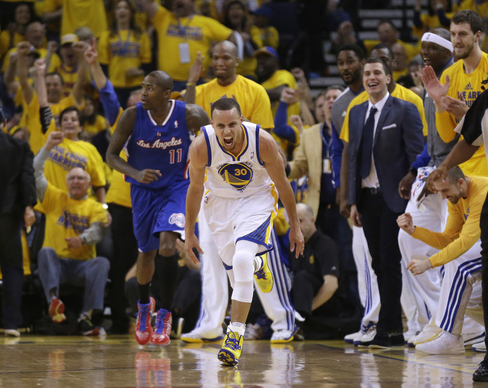 Golden State Warriors' Stephen Curry (30) celebrates after scoring next to Los Angeles Clippers' Jamal Crawford (11) during the first half in Game 4 of an opening-round NBA basketball playoff series on Sunday, April 27, 2014, in Oakland, Calif. (AP Photo/Marcio Jose Sanchez)