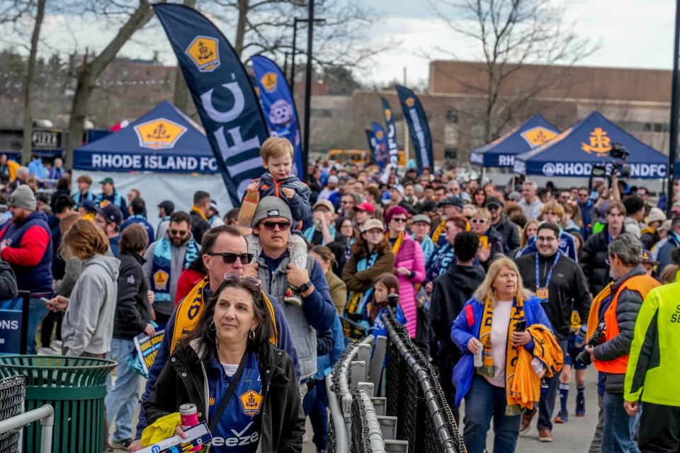 Rhode Island FC fans pack the parking lot at Bryant University’s Beirne Stadium before the start of the first game of the season.