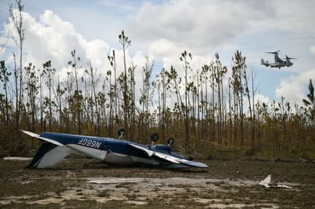 An overturned airplane is seen near the airport in the wake of Hurricane Dorian in Marsh Harbour