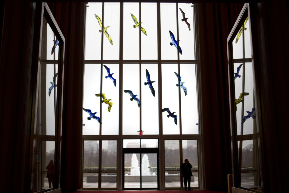 This photo taken Feb. 19, 2013 shows stained glass birds making up the installation "Migration," by artist Trondur Patursson, part of "Nordic Cool," an international festival being held at the Kennedy Center in Washington. More than 700 artists from Denmark, Finland, Iceland, Norway and Sweden, as well as Greenland, the Faroe Islands and the Aland Islands will present their work in theater, dance, music, visual arts, design, film, architecture and cuisine. (AP Photo/Jacquelyn Martin)