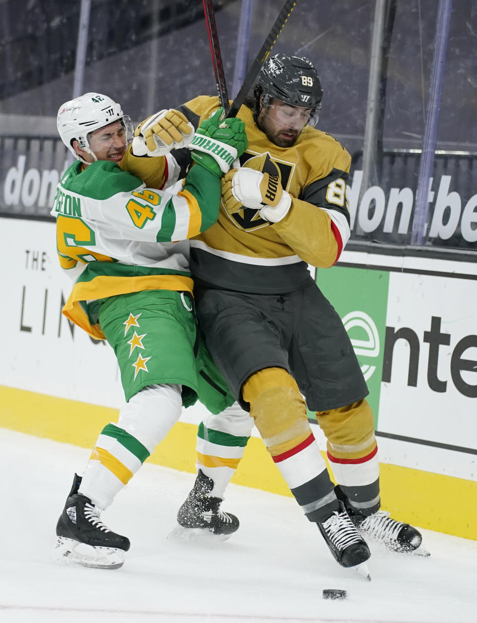 Minnesota Wild defenseman Jared Spurgeon (46) vies for the puck with Vegas Golden Knights right wing Alex Tuch (89) during the second period of an NHL hockey game Wednesday, March 3, 2021, in Las Vegas. (AP Photo/John Locher)