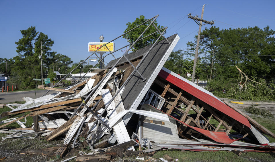 The decorative lighthouse is destroyed following Monday nights storm at Pat's Fisherman's Wharf restaurant, dance hall and hotel Tuesday, May 14, 2024 in Henderson, La. (Leslie Westbrook/The Times-Picayune/The New Orleans Advocate via AP)