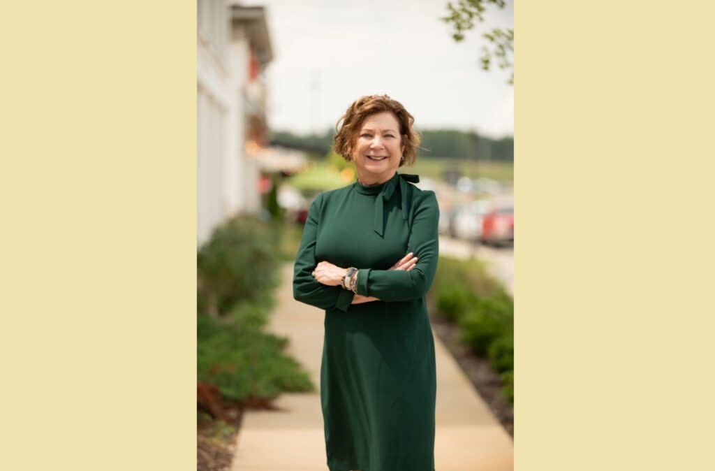 A woman in a green dress