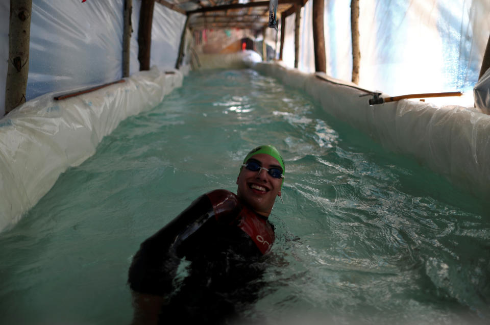 Sebastian Galleguillo, a paralympic swimmer who suffers from hearing loss, trains in the swimming pool his family built for him, during the outbreak of the coronavirus disease (COVID-19), in Florencio Varela, on the outskirts of Buenos Aires, Argentina July 13, 2020. Picture taken July 13, 2020. REUTERS/Agustin Marcarian