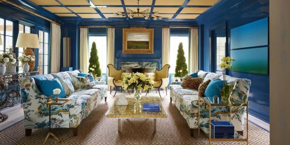 <p>This <a href="https://www.elledecor.com/design-decorate/house-interiors/a8631/most-beautiful-homes-in-east-hampton/" rel="nofollow noopener" target="_blank" data-ylk="slk:Celerie Kemble-designed living room;elm:context_link;itc:0;sec:content-canvas" class="link ">Celerie Kemble-designed living room</a> features a creative mix of accent colors, including soft yellow, which work beautifully with the high-gloss blue walls.</p>