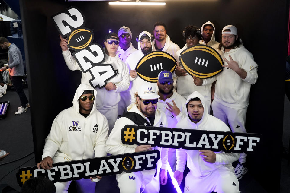 Members of the Washington defense pose during media day ahead of the national championship NCAA College Football Playoff game between Washington and Michigan Saturday, Jan. 6, 2024, in Houston. The game will be played Monday. (AP Photo/Godofredo A. Vasquez)