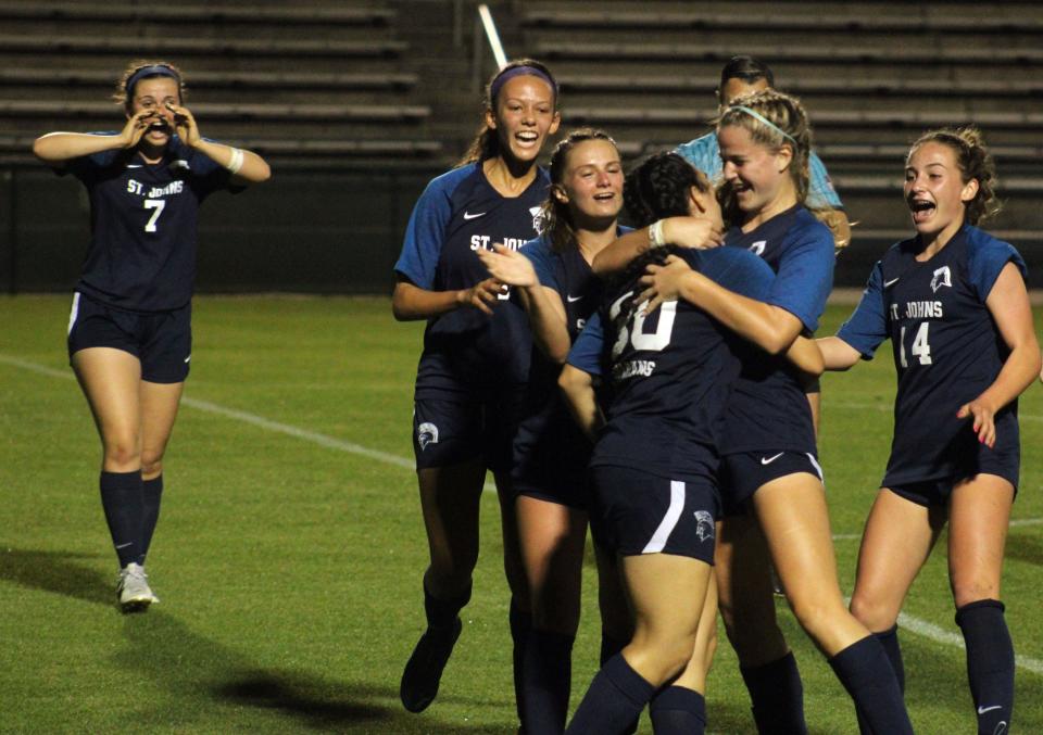 St. Johns Country Day players celebrate the go-ahead goal by forward Julia Boaventura (30) against Shorecrest Prep during the Florida High School Athletic Association Class 2A girls soccer final on February 23, 2022. [Clayton Freeman/Florida Times-Union]