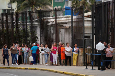 People wait in line to enter the U.S. embassy in Havana, Cuba, March 18, 2019. REUTERS/Alexandre Meneghini