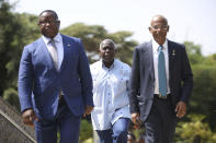 From left, President of Sierra Leone Julius Maada Bio, Prime Minister of the Bahamas Philip Davis and President of the Maldives, Ibrahim Mohamed Solih arrive for the Leaders' Retreat on the sidelines of the Commonwealth Heads of Government Meeting at Intare Conference Arena in Kigali, Rwanda, Saturday, June 25, 2022. (Dan Kitwood/Pool Photo via AP)