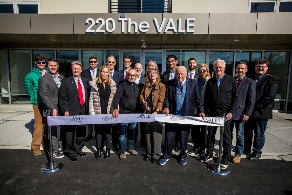 Allendale Mayor Amy Wilczynski and borough officials celebrate the ribbon cutting for The Vale 70-unit multifamily building at 220 W. Crescent Ave. on the former Black Millwork property.