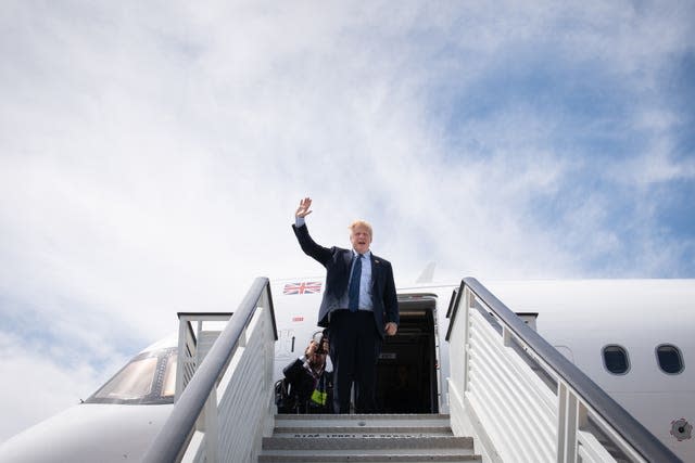 Prime Minister Boris Johnson boarding a plane as he leaves the Nato summit in Madrid