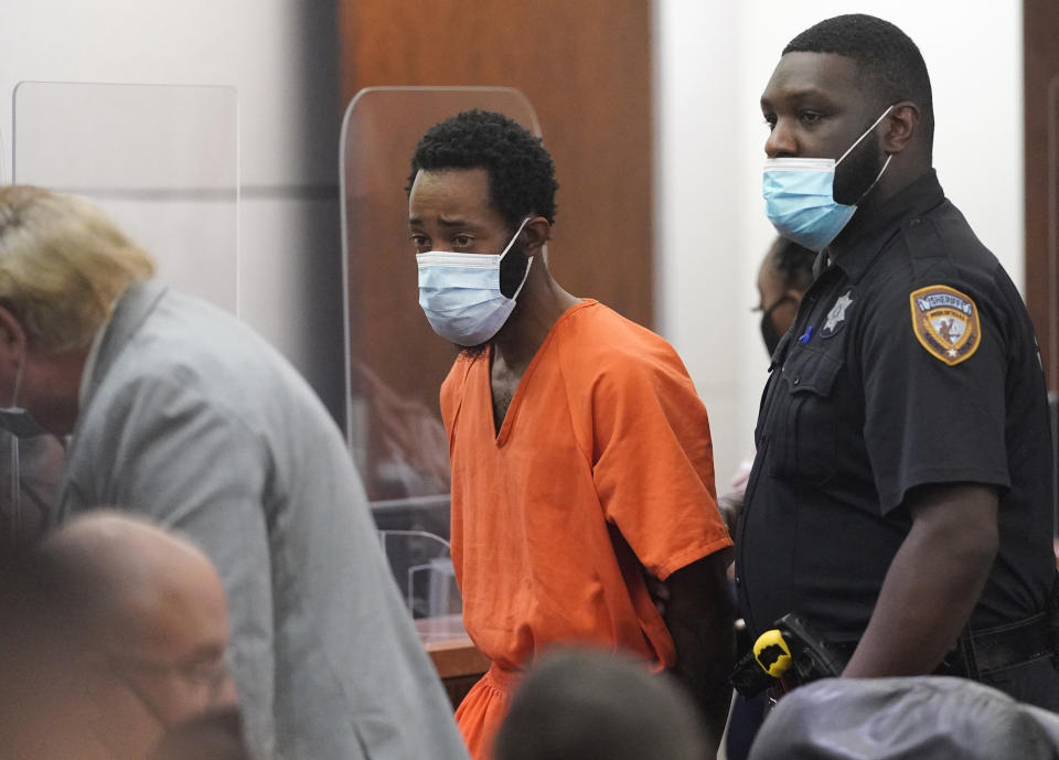 Tony D. Earls is escorted from the Harris County 263rd District Criminal Court Thursday, Feb. 17, 2022, in Houston. He is accused of shooting and killing 9-year-old, Arlene Alvarez, while firing at what he thought was a robbery suspect's vehicle as her father drove her and her siblings by a Chase bank . (Melissa Phillip/Houston Chronicle via AP)