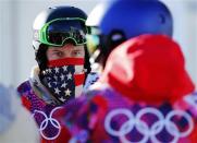 U.S. snowboarder Shaun White waits in line during a breakdown of the chairlift at snowboard slopestyle training for the 2014 Sochi Winter Olympics in Rosa Khutor, February 3, 2014. REUTERS/Mike Blake