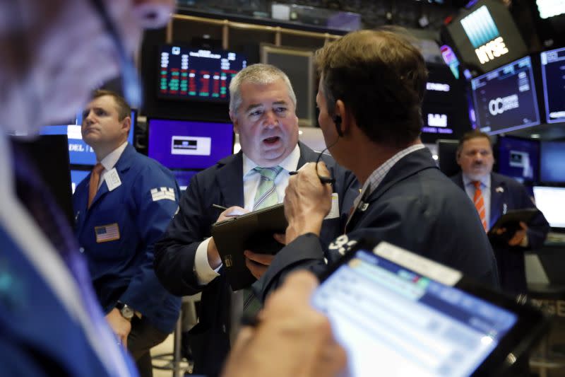 Traders work on the floor of the New York Stock Exchange. 