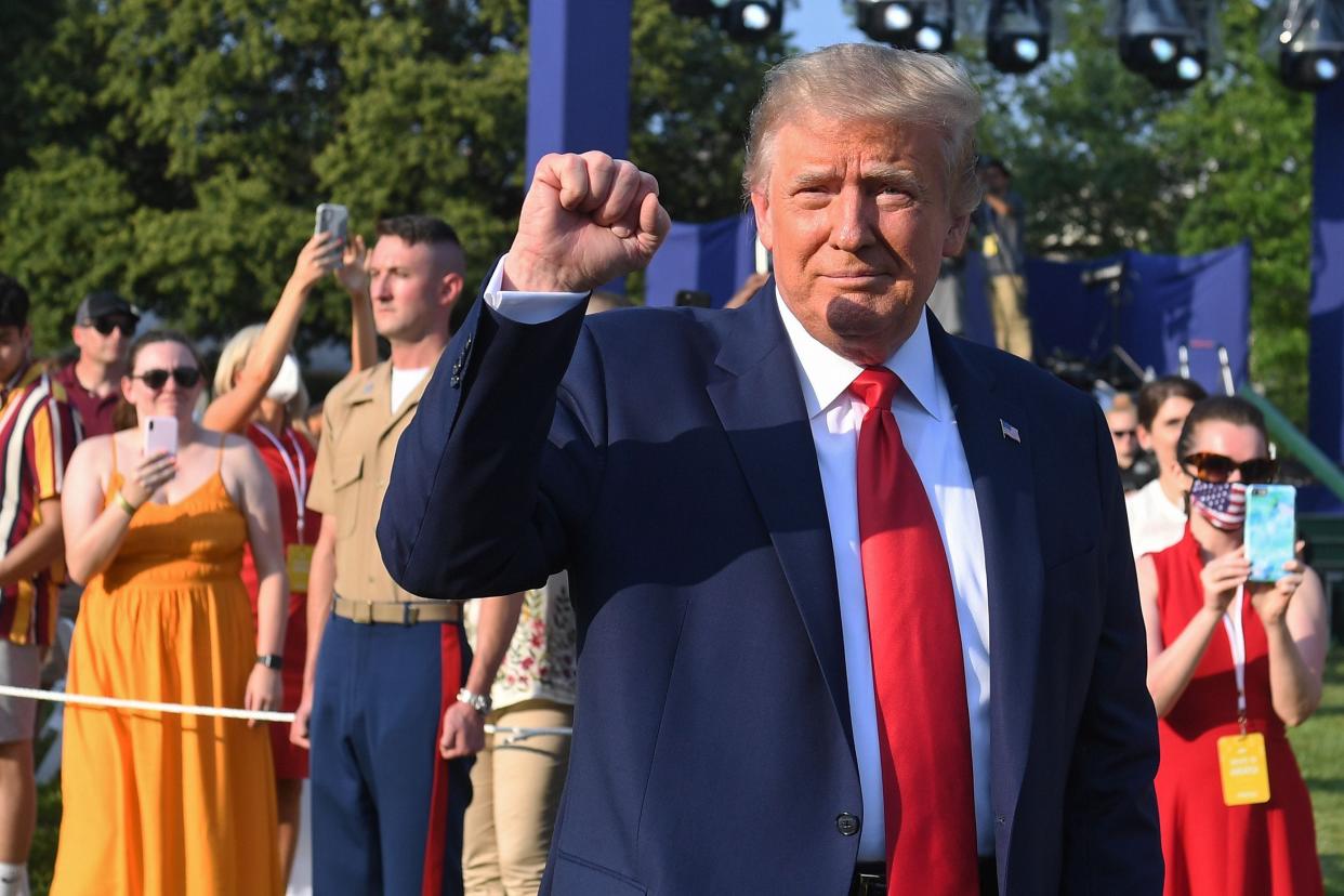 President Donald Trump pumps his fist as he arrives for the 2020 "Salute to America" event in honor of Independence Day on the South Lawn of the White House in Washington, DC, July 4, 2020.