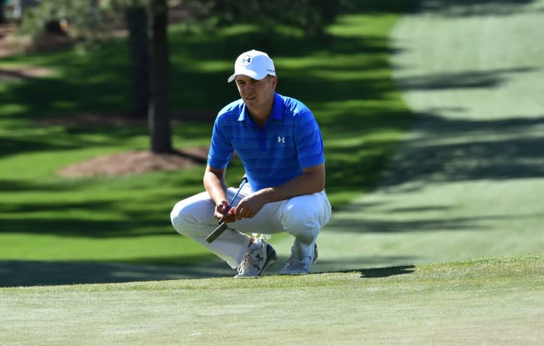 US golfer Jordan Spieth lines up a putt on the 7th hole during Round 4 of the 80th Masters Golf Tournament at the Augusta National Golf Club on April 10, 2016