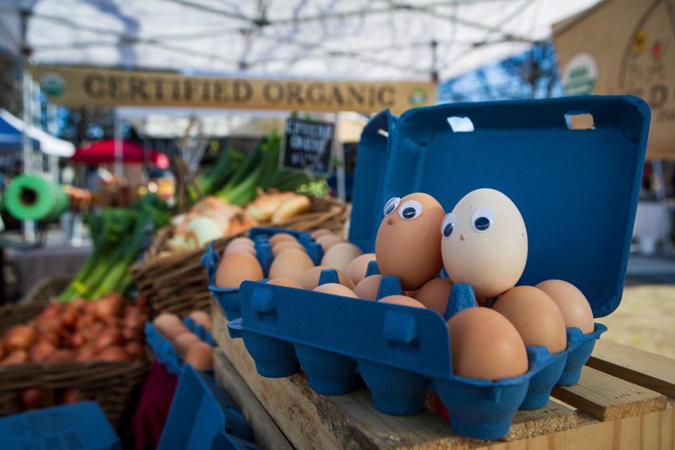 A pair of eggs adorned with googly eyes sit at Wild Child Farm’s booth on the opening day of the Lane County Farmers Market’s Winter Market on Feb. 24.
