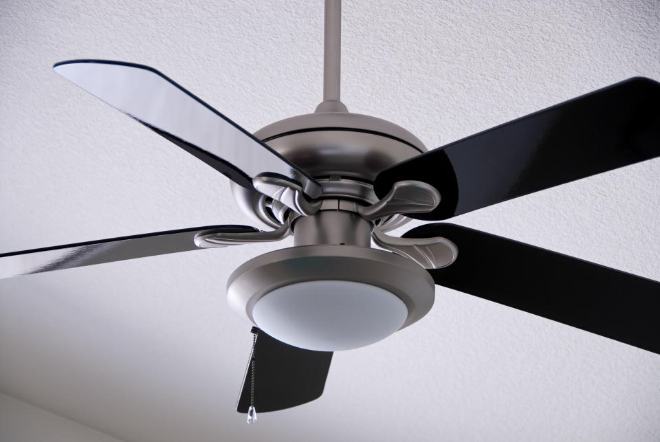 There's more than one direction for using a ceiling fan. (Photo: James Ferrie / EyeEm via Getty Images)