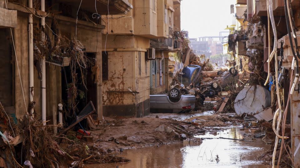 Overturned cars lay among other debris caused by flash floods in Derna, eastern Libya, on September 11, 2023.  - AFP/Getty Images