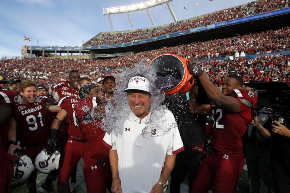 South Carolina head football coach Steve Spurrier gets a celebratory bath from his players as time winds down in the Gamecocks’ 30-13 win over Nebraska in the Capital One Bowl game at the Citrus Bowl in Orlando, Fla., on Jan. 2, 2012.