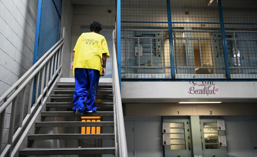 LOS ANGELES, CA-OCTOBER 2, 2017: An inmate inside Century Regional Detention Facility in Los Angeles heads towards her upstairs cell on Monday, October 2, 2017. The jail, which houses female inmates, is where two alleged rapes by a male guard happened earlier this month. The alleged assaults came at a time when the Los Angeles County Sheriff's Department, which runs the jail, is trying to implement changes to ensure the sexual safety of inmates and become compliant with a federal mandate to eliminate prison rape. (Christina House / Los Angeles Times)