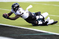 Baltimore Ravens' Gus Edwards (35) scores a touchdown as Philadelphia Eagles' Shaun Bradley (54) during the first half of an NFL football game, Sunday, Oct. 18, 2020, in Philadelphia. (AP Photo/Derik Hamilton)