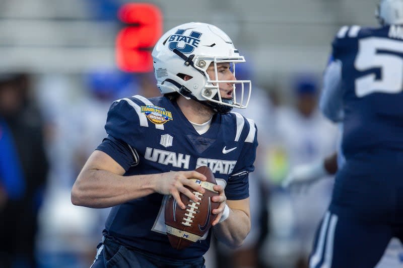 Utah State quarterback McCae Hillstead looks downfield against Georgia State in the Famous Idaho Potato Bowl, Saturday, Dec. 23, 2023, in Boise, Idaho. | Steve Conner, Associated Press