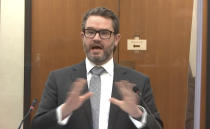 In this image from video, defense attorney Eric Nelson questions Minneapolis Police Officer Nicole Mackenzie as Hennepin County Judge Peter Cahill presides, Tuesday, April 13, 2021, in the trial of former Minneapolis police Officer Derek Chauvin at the Hennepin County Courthouse in Minneapolis, Minn. Chauvin is charged in the May 25, 2020 death of George Floyd. (Court TV via AP, Pool)