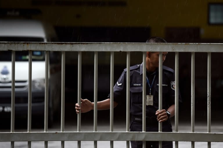 A Malaysian policeman closes the gate of the forensics wing of the Hospital Kuala Lumpur, where the body of Kim Jong-Nam resided the Malaysian capital