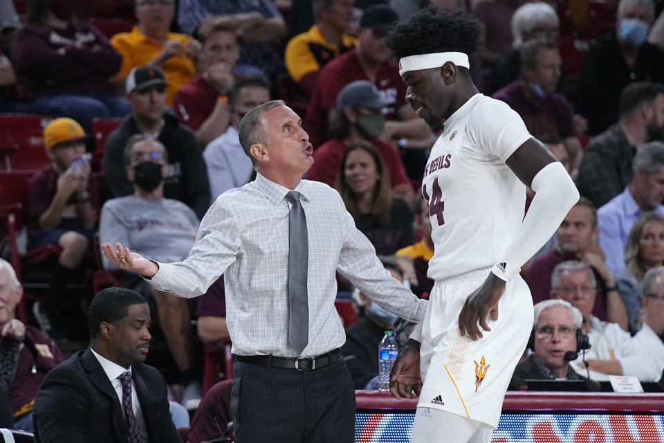 Arizona State coach Bobby Hurley talks to center Enoch Boakye during the first half of the team's NCAA college basketball game against Washington State, Wednesday, Dec. 1, 2021, in Tempe, Ariz. (AP Photo/Rick Scuteri)