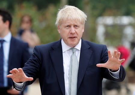 FILE PHOTO: Boris Johnson, a leadership candidate for Britain's Conservative Party, arrives for a walkabout at Wisley Garden Centre in Surrey