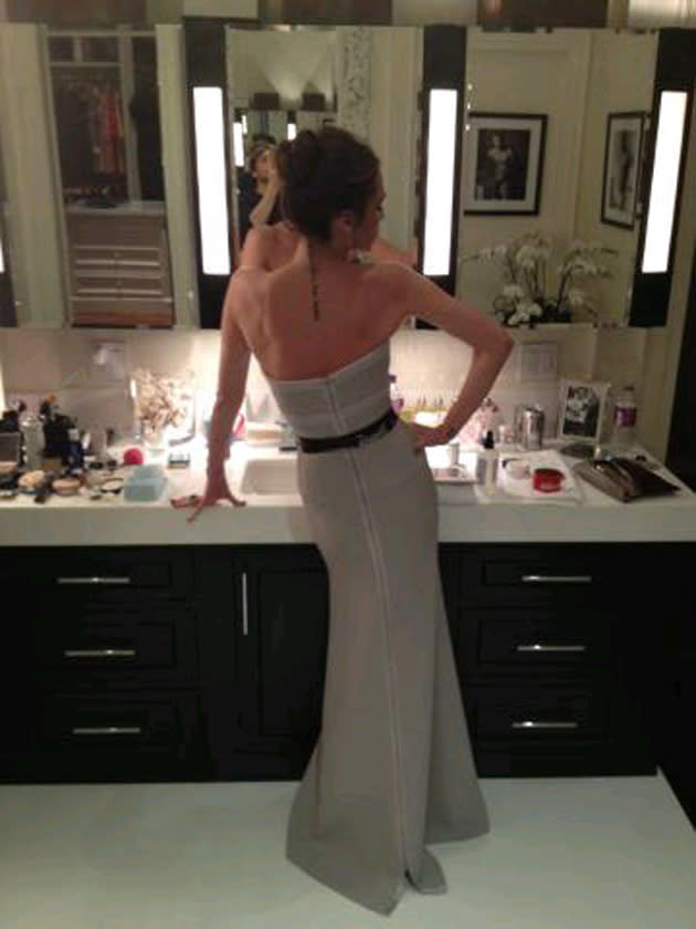 Celebrity photos: Victoria Beckham tweeted this picture on the night of the Oscars as she got ready for the Vanity Fair after-party. We love the fact that there’s a framed photo of David Beckham in his pants on the wall as well!