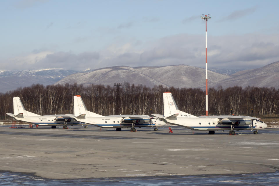 The Antonov An-26 with the same board number #RA-26085 as the missed plane is parked between two other Antonov An-26 planes at Airport Elizovo outside Petropavlovsk-Kamchatsky, Russia, Tuesday, Nov. 17, 2020.Local officials say a plane with 28 people on board has gone missing in the Russian Far East region of Kamchatka. Emergency officials say the Antonov An-26 plane with 22 passengers and six crew members missed a scheduled communication while it was flying Tuesday from the city of Petropavlovsk-Kamchatsky to the village of Palana. (AP Photo/Marina Lystseva)