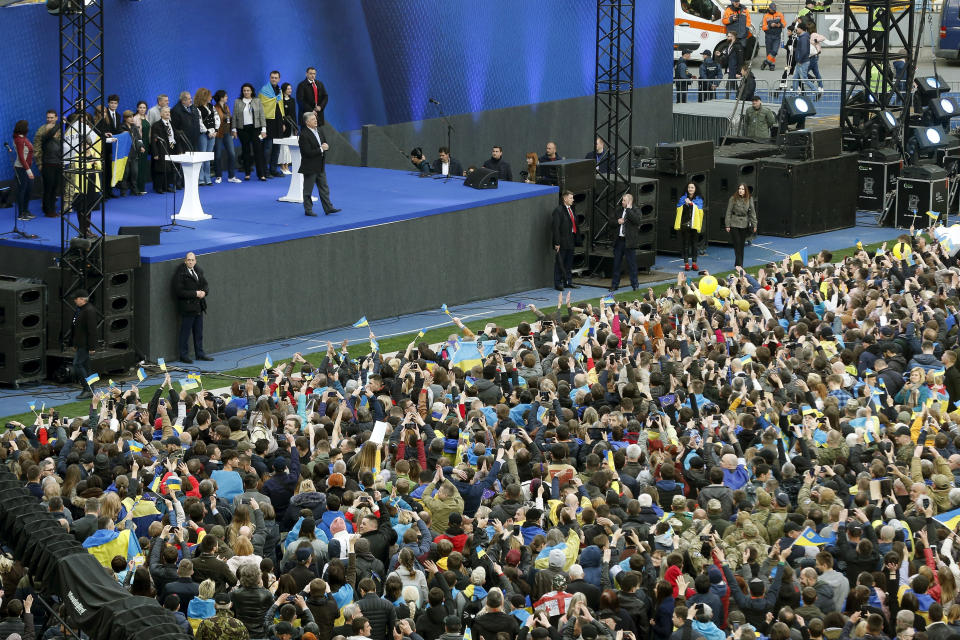 Ukrainian President Petro Poroshenko arrives to attend debates between two candidates in the weekend presidential run-off at the Olympic stadium in Kiev, Ukraine, Friday, April 19, 2019. Friday is the last official day of election canvassing in Ukraine as all presidential candidates and their campaigns will be barred from campaigning on Saturday, the day before the vote. (AP Photo/Efrem Lukatsky)