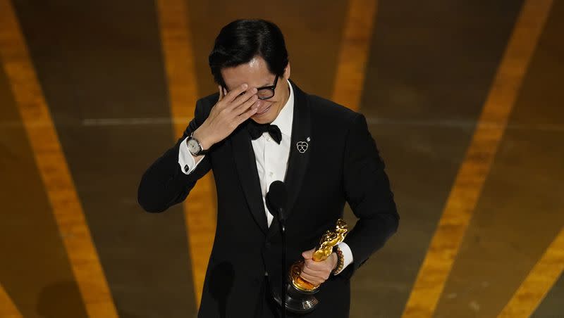 Ke Huy Quan accepts the award for best performance by an actor in a supporting role for “Everything Everywhere All at Once” at the Oscars on Sunday, March 12, 2023, at the Dolby Theatre in Los Angeles.