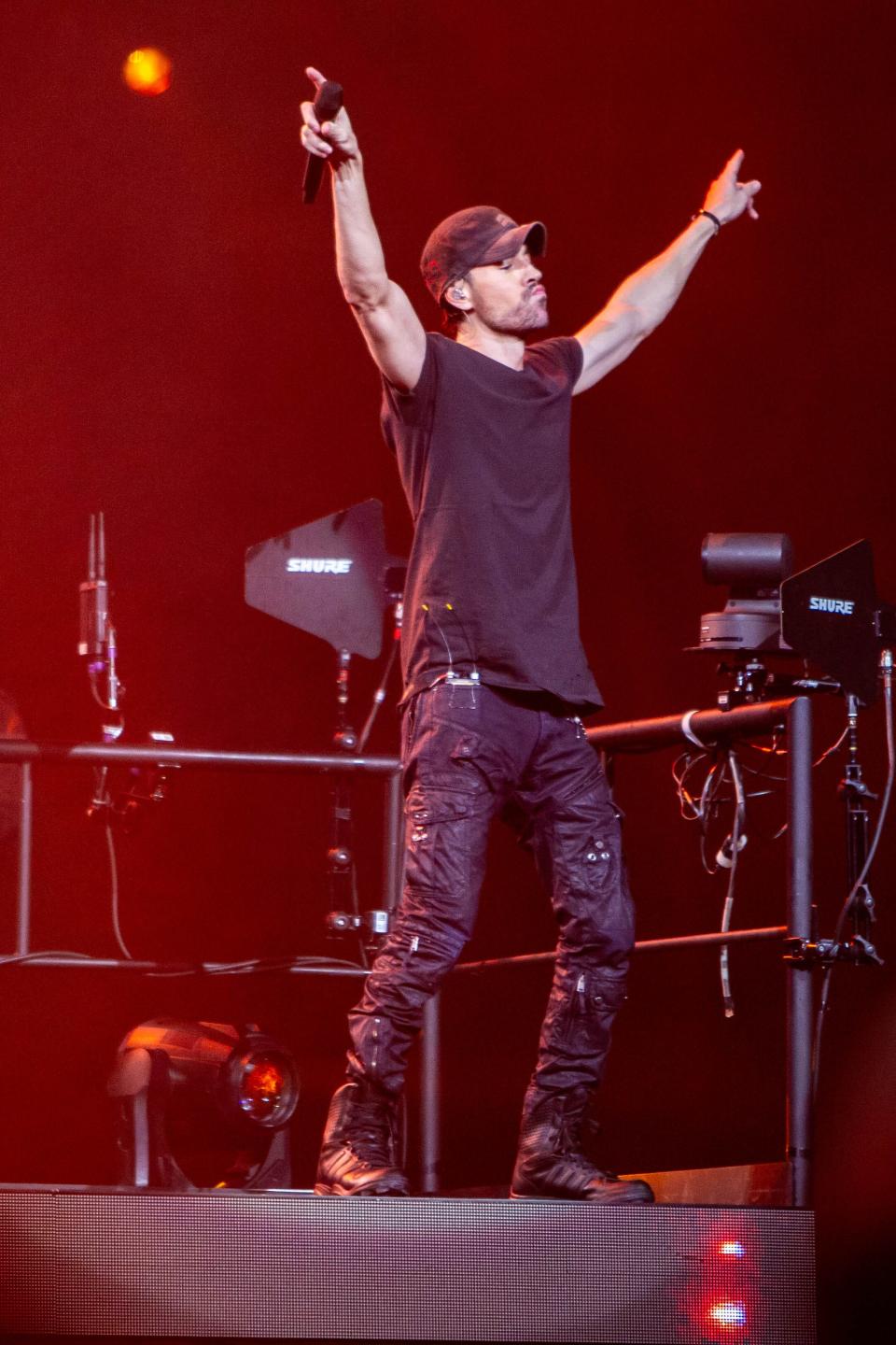 Enrique Iglesias, pictured here performing at the Trilogy Tour at the Footprint Center in Phoenix, will play with Ricky Martin and Pitbull at Amalie Arena on March 10.